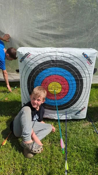 Eddie shooting Archery from Langwood campout 2024.jpg